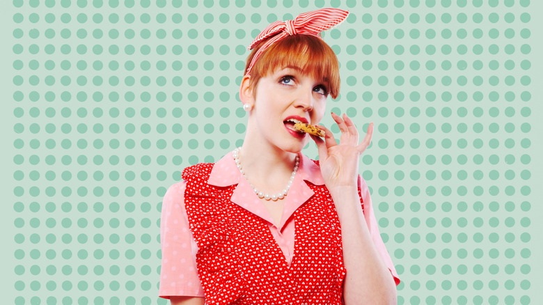 vintage housewife eating cookie