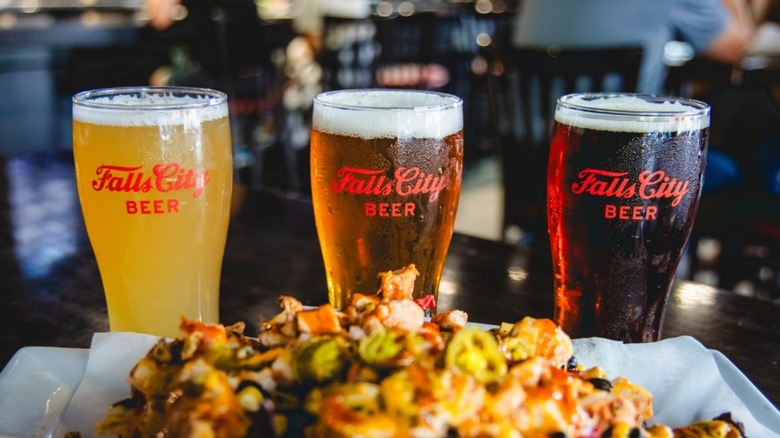 three pints of Falls City Beer