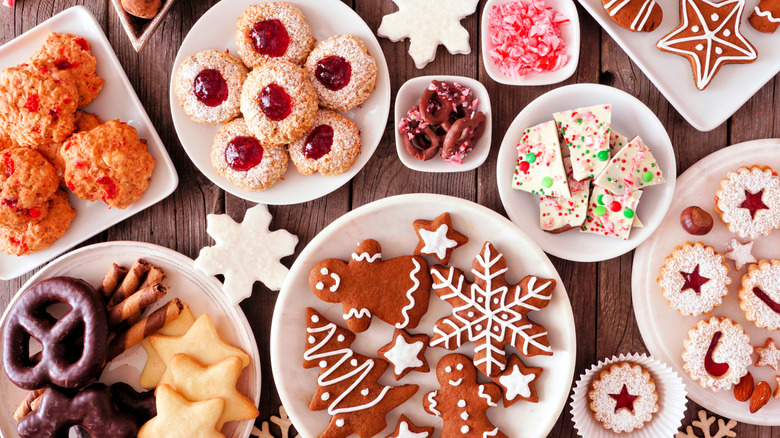 an assortment of cookies on wooden table