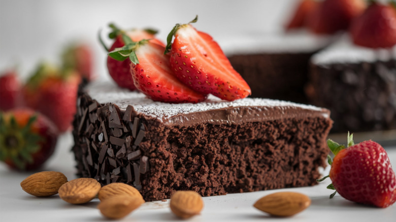 flourless chocolate cake slice with strawberries