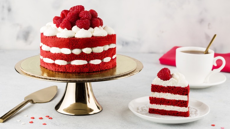 red velvet cake on golden stand