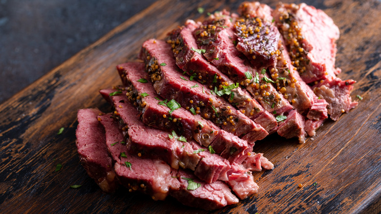 sliced corned beef on cutting board