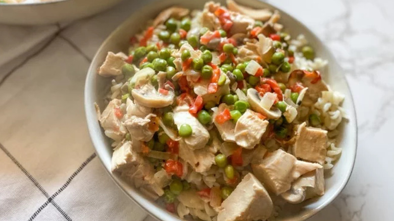chicken a la king in bowl with peas