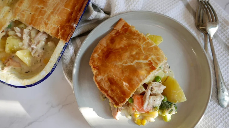 Chicken pot pie on plate and in casserole pan