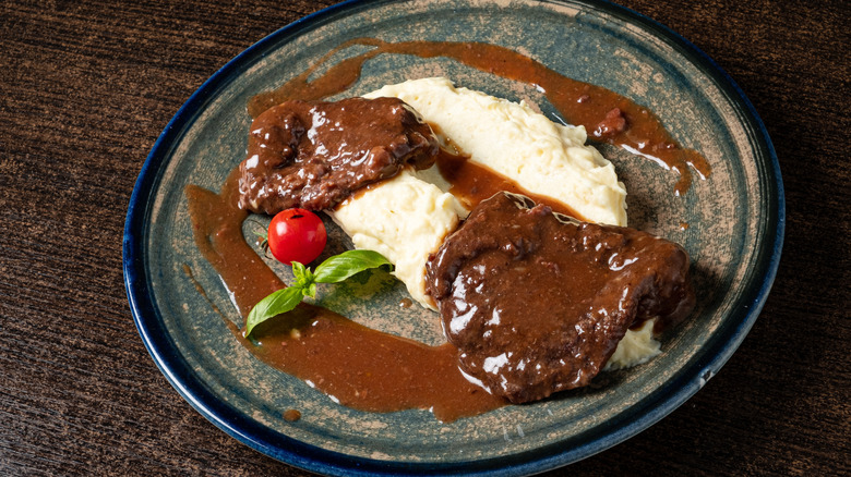 Smothered steak with mashed potatoes