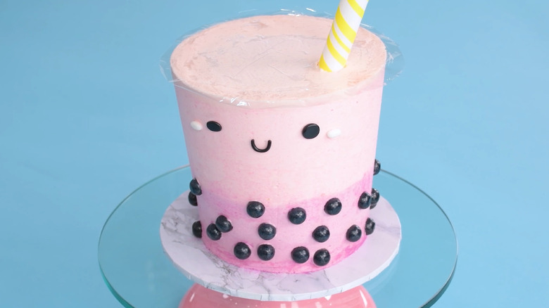 smiling boba cake with straw