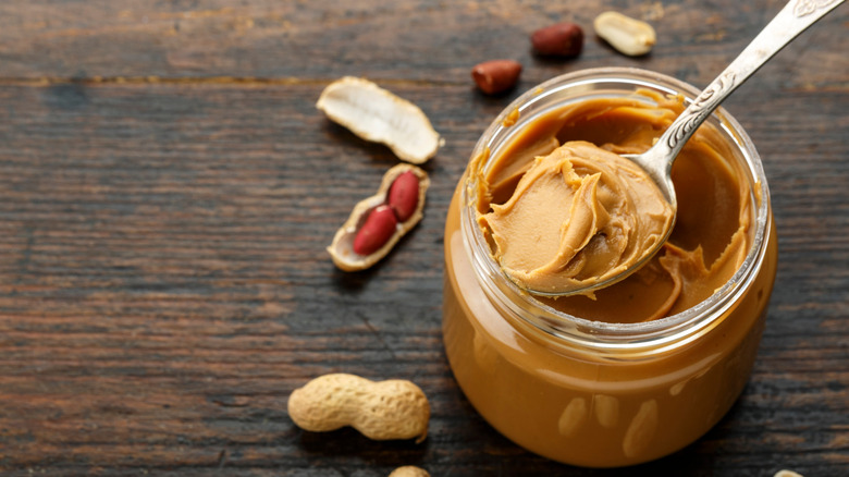 Spoon in peanut butter jar