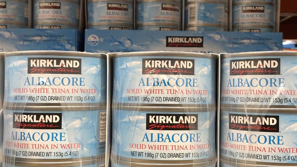 Stacked cans of Kirkland albacore tuna