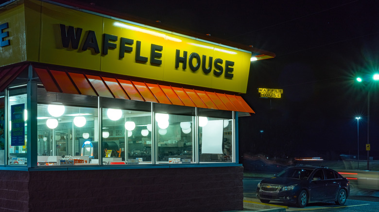 exterior of empty waffle house at night