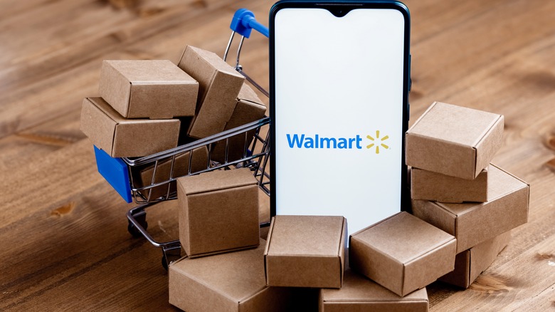 Smartphone, small cart, and boxes