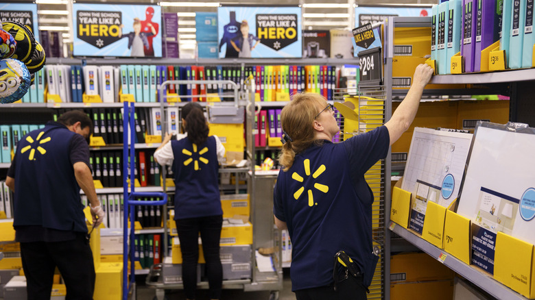Unmasked Walmart employees stocking shelves