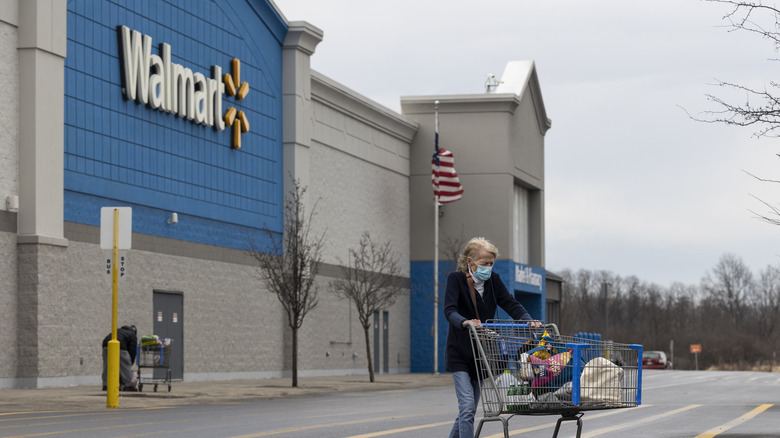 Woman outside Walmart with cart