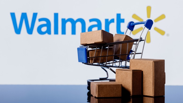 Walmart logo behind shopping cart