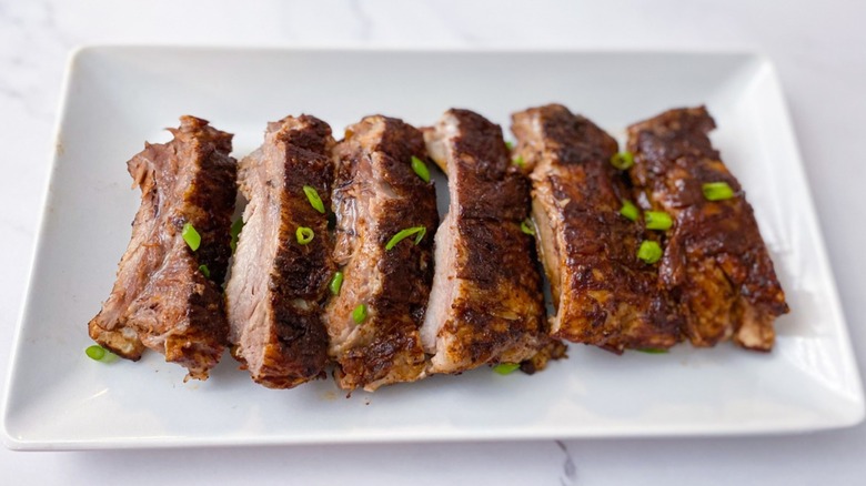 Close-up of sauced ribs on plate