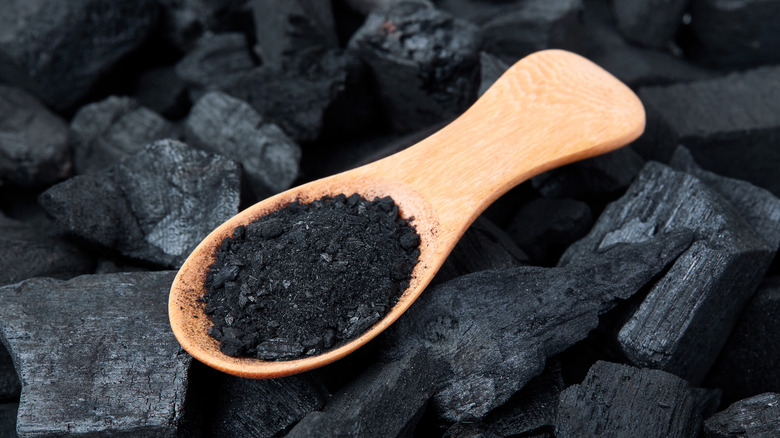 Charcoal on spoon on top of charcoal