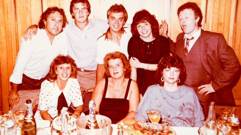 Group attending 1980s-era dinner party