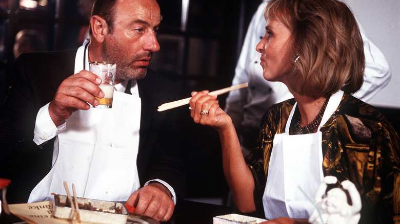 Man and woman at restaurant in 1980s
