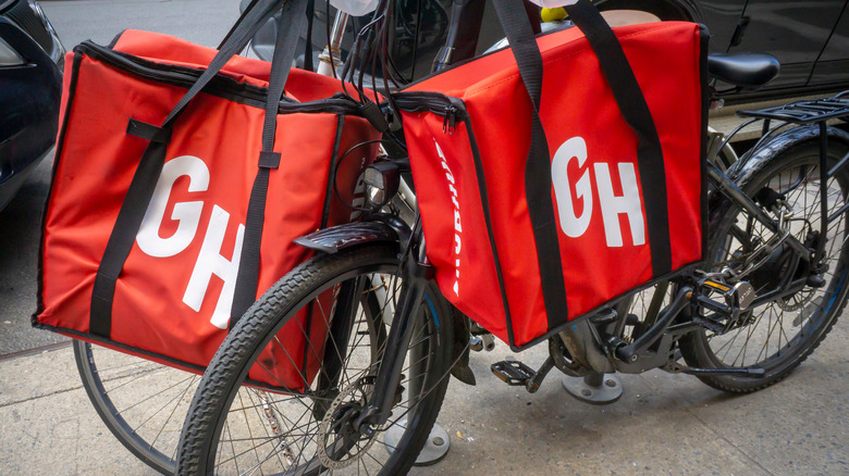 Red Grubhub bags on a bike