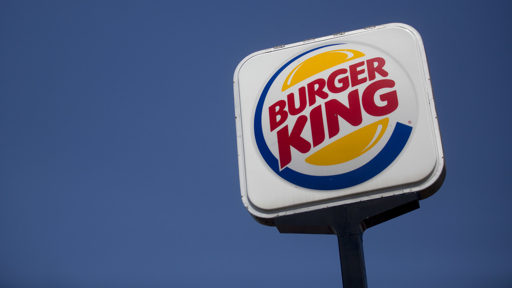 Burger King sing with blue sky background