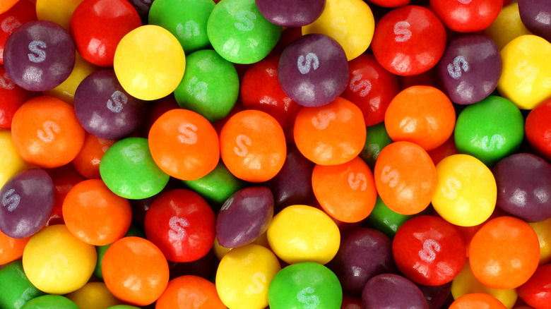 Purple, green, red, orange, and yellow Skittles