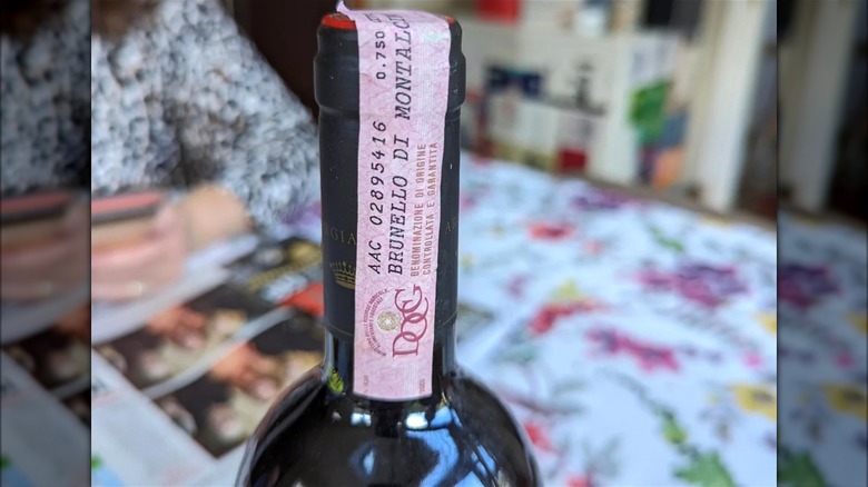 Close-up of a DOCG seal on a bottle of Italian wine.