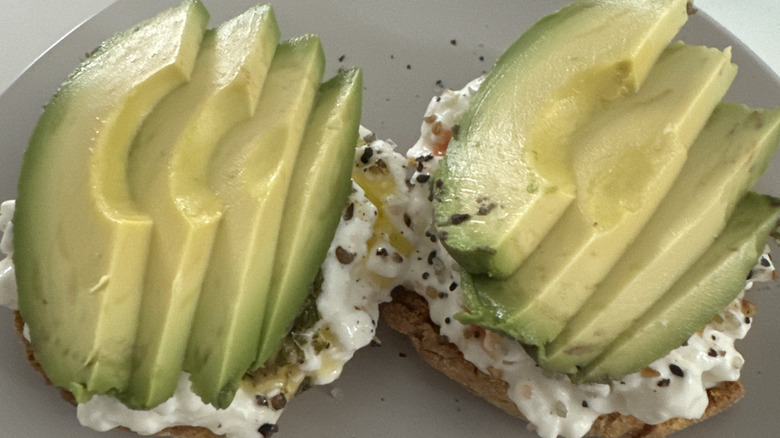 Cottage cheese and sliced avocado on toast