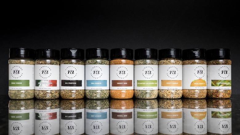 row of seasoning containers lined up