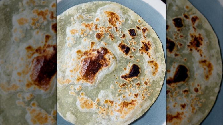 charred caramelo flour tortilla on plate