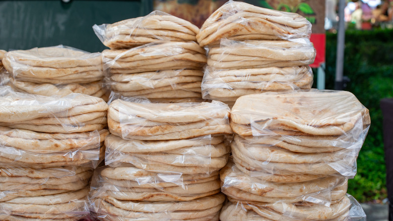 tortillas in large bags on table
