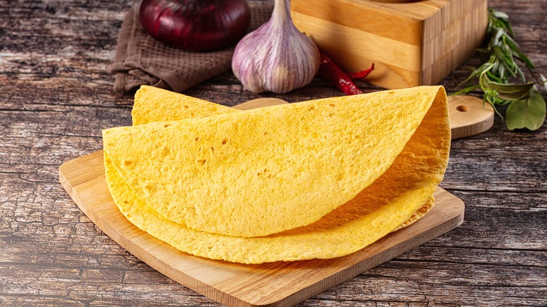 corn tortlila on cutting board