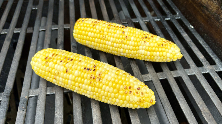 Shucked corn on grill