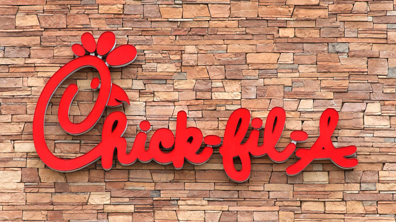 Chick-fil-A logo on a brick wall