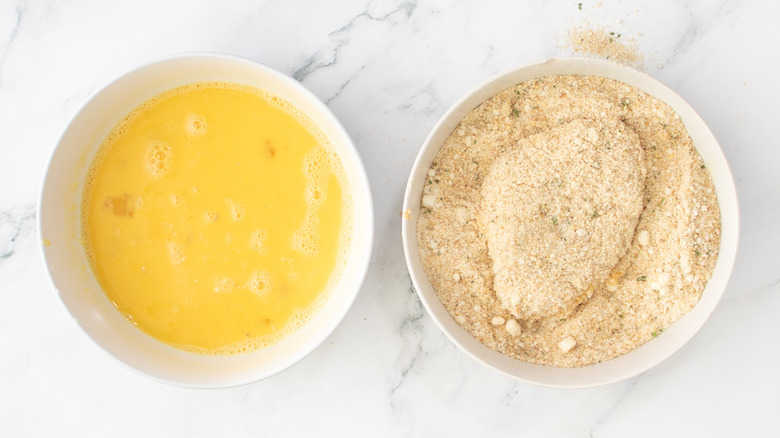 raw chicken in breadcrumbs
