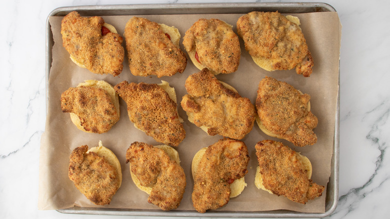 slider buns with chicken in a pan