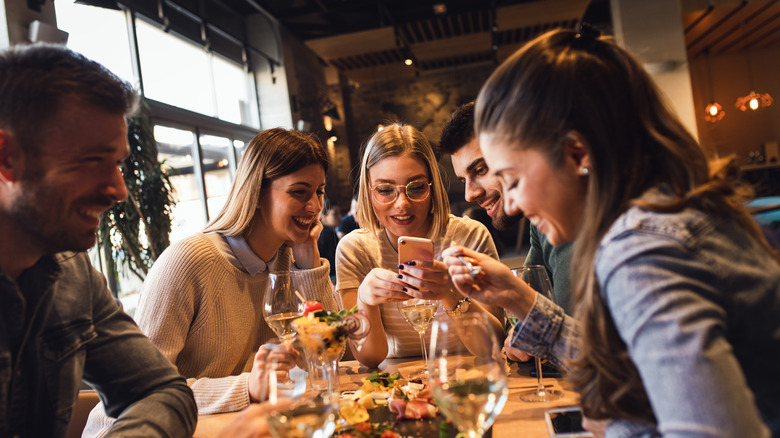 Group of people at a restaurant smiling