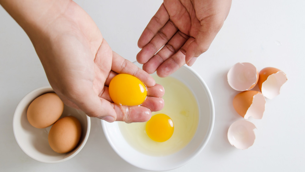Separating egg using fingers