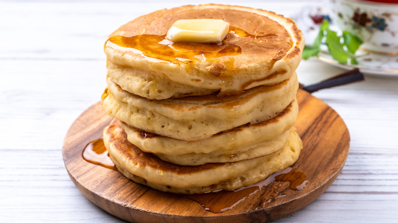 Stack of pancakes with butter and syrup