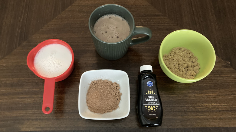 Bowls of ingredients for hot chocolate with milk