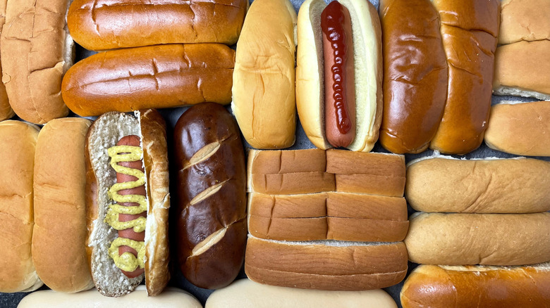 Various hot dog buns and hot dogs