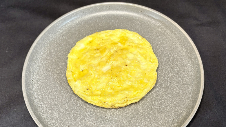 Scrambled eggs on grey plate