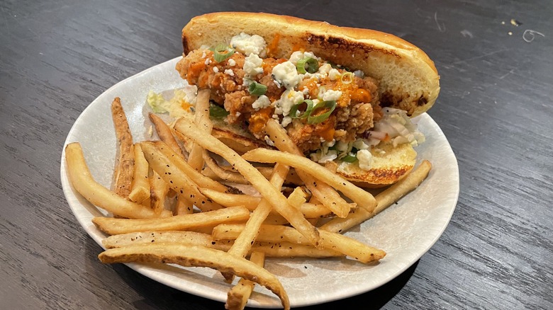 A bird Dawg sandwich with fries