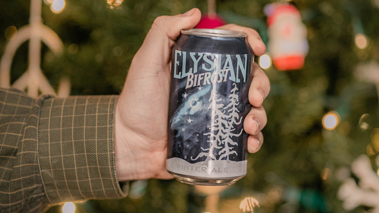 Hand holding can of beer