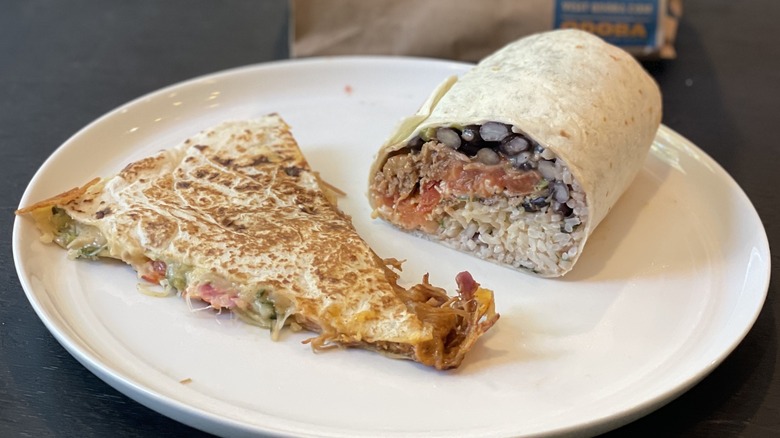 a burrito and quesadilla on a plate