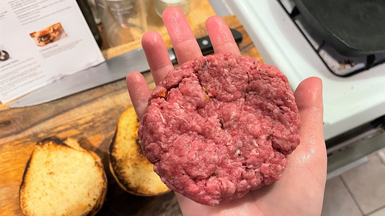 A burger patty formed with Rachael Ray's instructions for making the perfect burgers