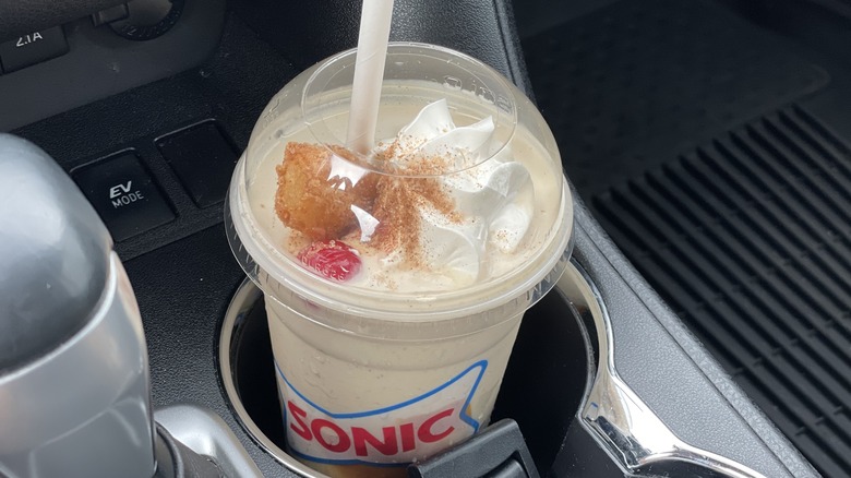 a new churro shake in a cupholder