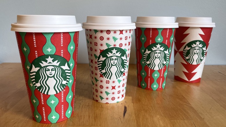 Four festive Starbucks cups