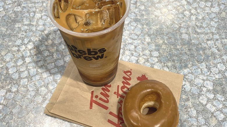 A large iced Biebs Brew and maple doughnut from Tim Hortons