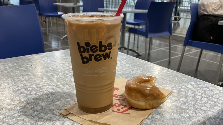A large iced Biebs Brew and maple doughnut from Tim Hortons