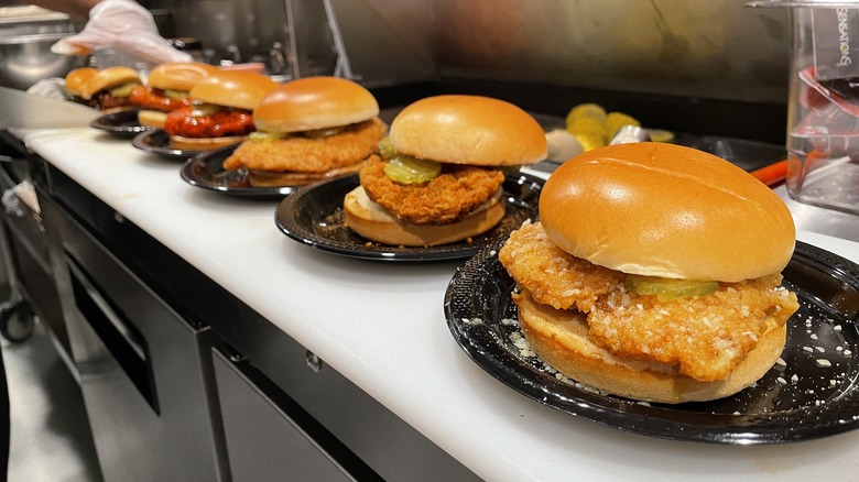 Customized chicken sandwiches in the kitchen at Wingstop