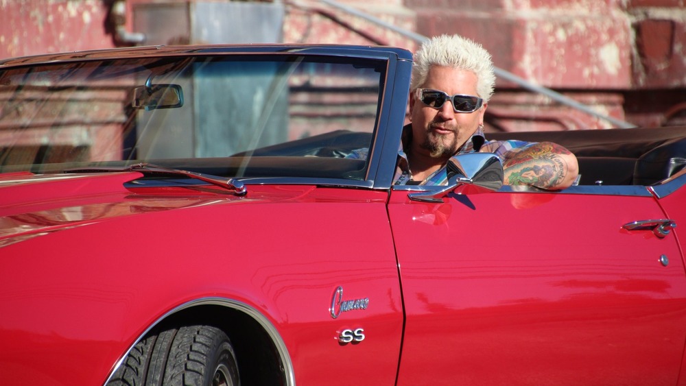 Guy Fieri drives red Camaro